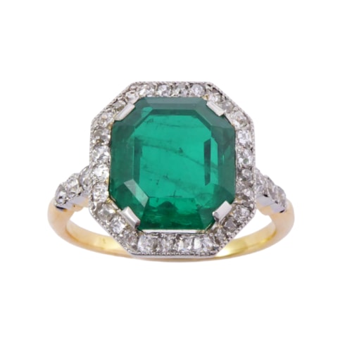 Early 20th century emerald and diamond cluster ring, c.1910, the cut-corner rectangular 4.44ct Colombian emerald,